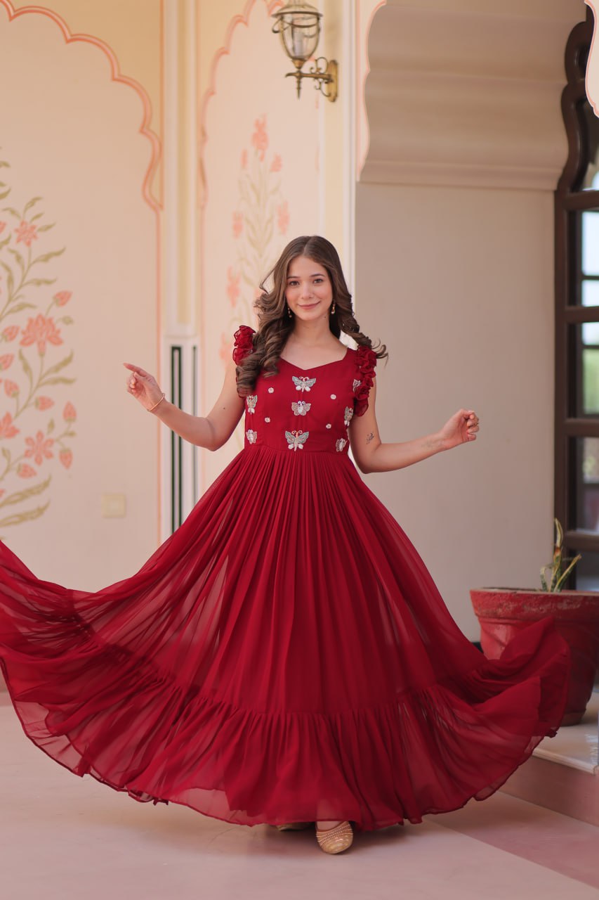 Lavi 7-meter flared designer gown in faux blooming fabric with sequin & bead embroidery, V-neck & frill shoulders – perfect for weddings & parties.